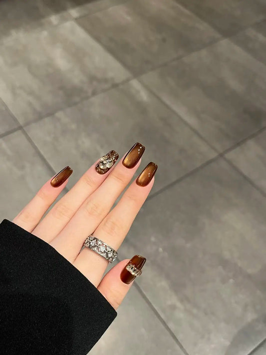 Amber Cat Eye - Lifestyle shot on hand.