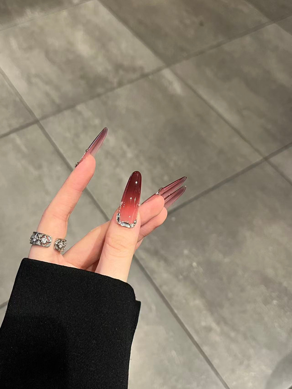 Luxurious deep red press-on nails that look real, featuring handcrafted resin quality.