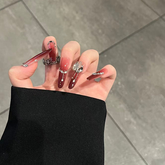 Detailed hand-painted artistry of Crimson Muse burgundy nails—perfect for date night.